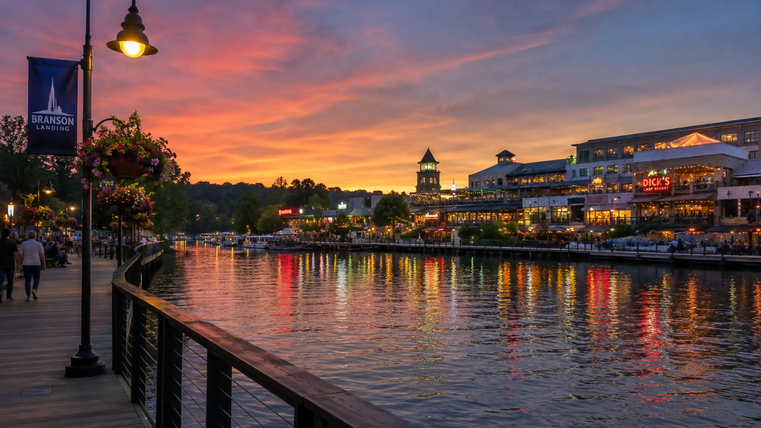 Branson Landing waterfront boardwalk on Lake Taneycomo at dusk
