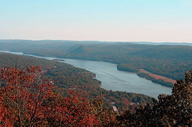 Lake winding through hills covered in fall foliage